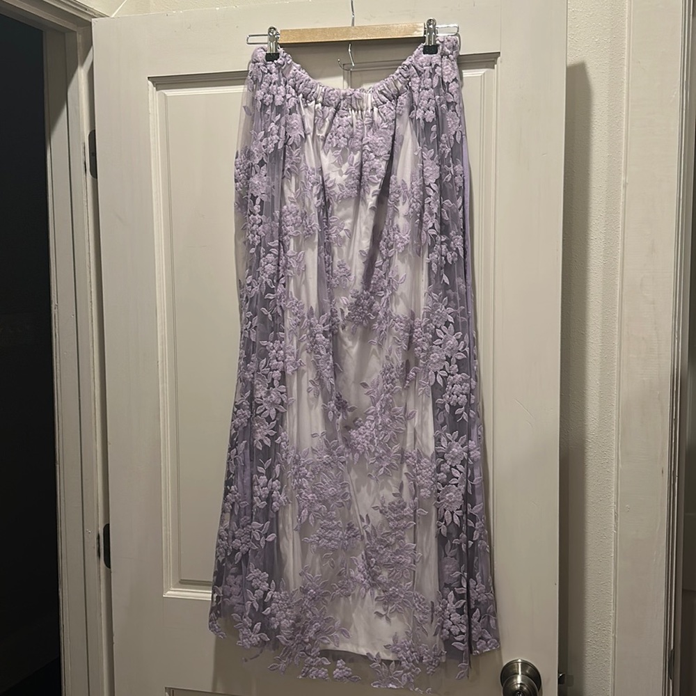 Cape dress with elastic neckline.